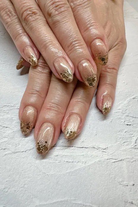 Nude Nails with Gold Glitter Gradient Tips - manicure idea for women over 40