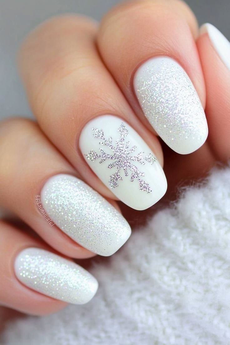 White glitter nails with large statement snowflake accent nail