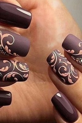 Mauve nails with delicate gold swirl nail art for older women