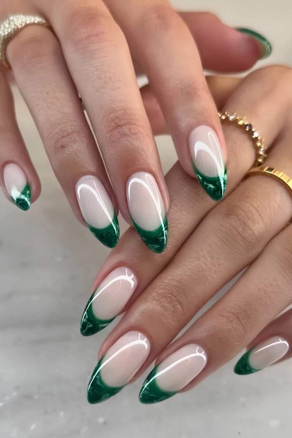 Nude nails with deep green french tips, winter french manicure