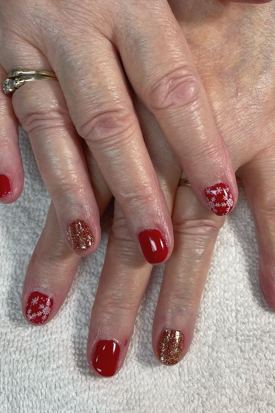 Red nails with gold glitter accent nail, holiday manicure