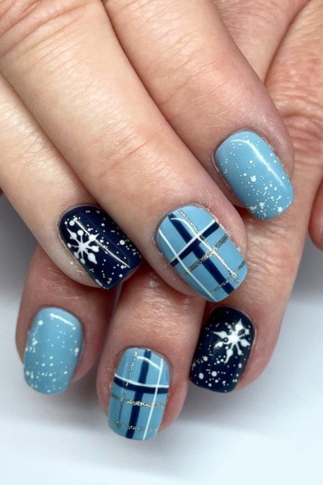 Light blue plaid nails with white snowflake art, winter scarf pattern