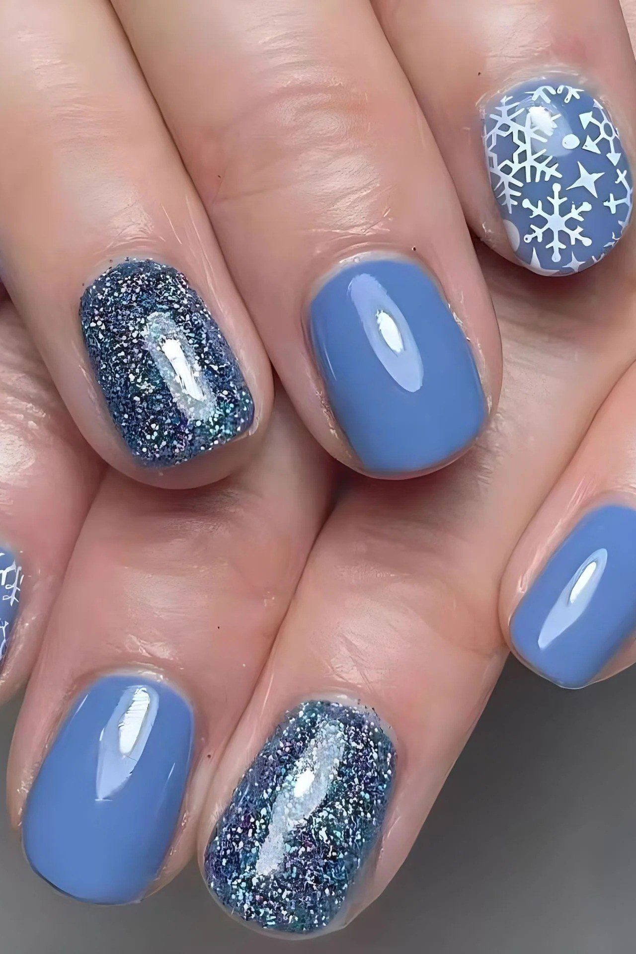 Periwinkle nails with silver glitter snowflake accents