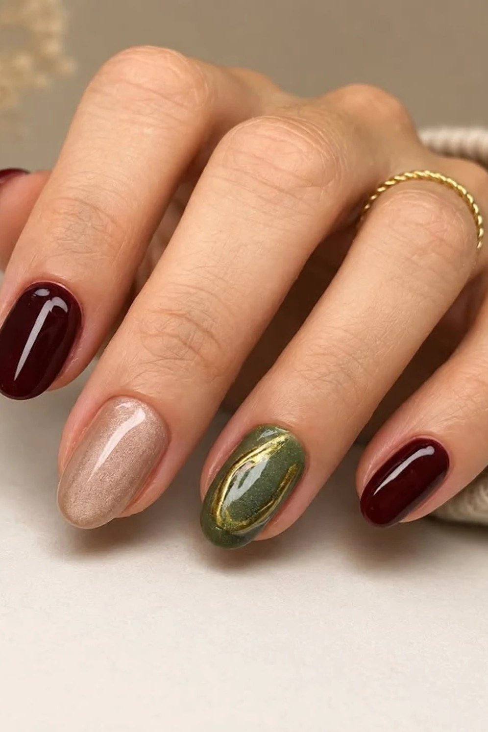 Burgundy, Olive and Champagne Shimmer on short oval nails for women over 60