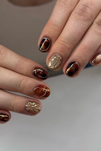 Amber Tortoiseshell with Gold Florals on short oval nails for women over 60