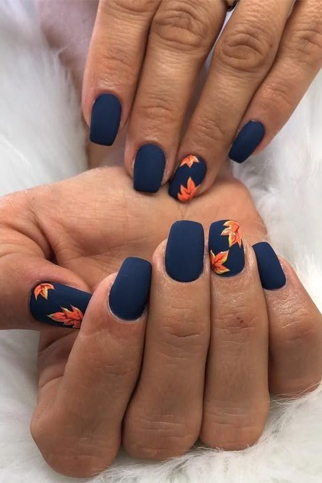 Deep Navy with Maple Leaf Art on short oval nails for women over 60