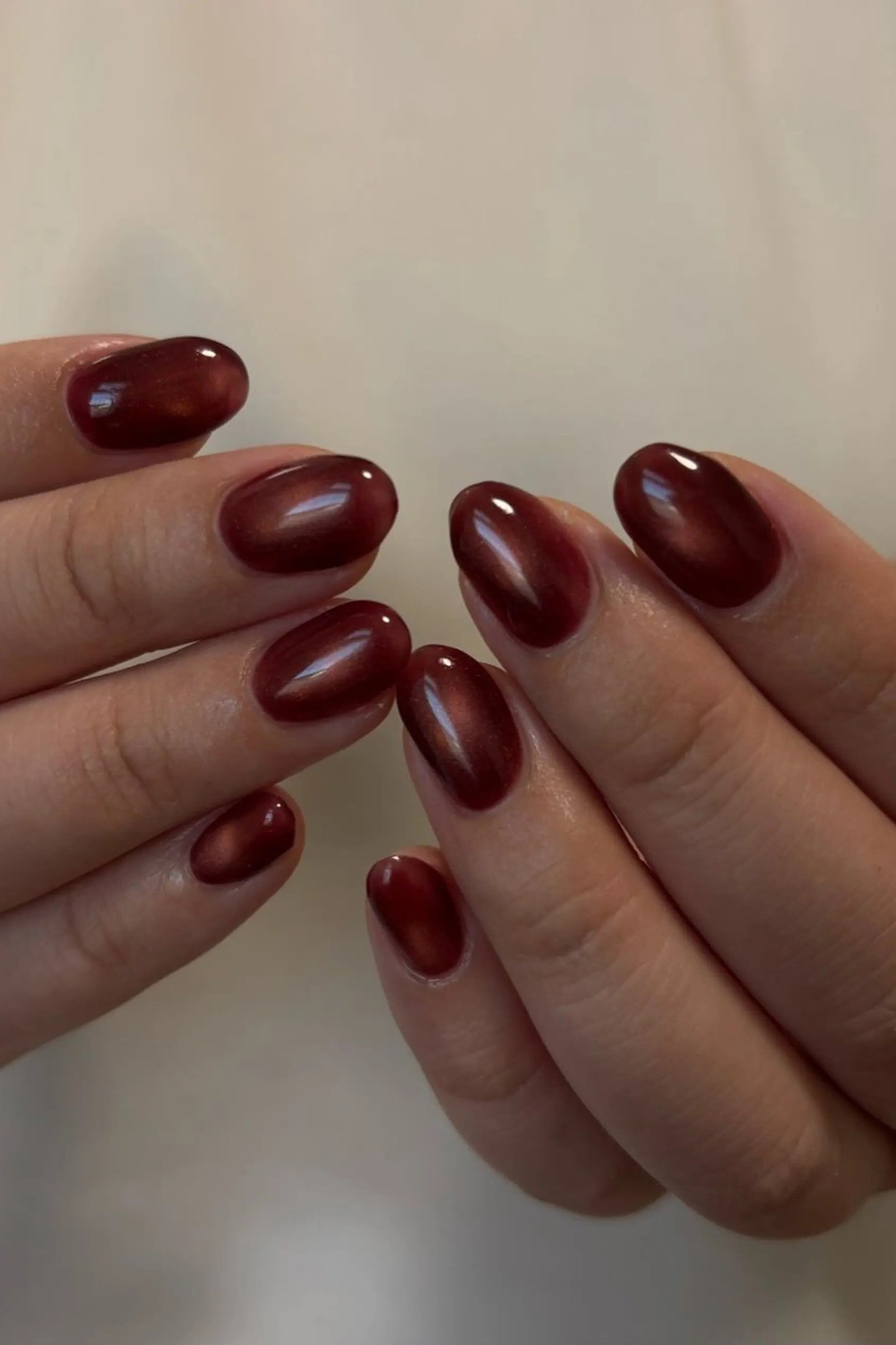 Smoky Burgundy Cat-Eye on short oval nails for women over 60