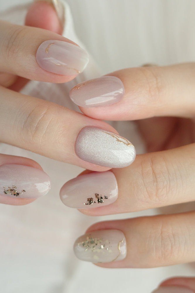 White with Gold Star Glitter on short oval nails for women over 60