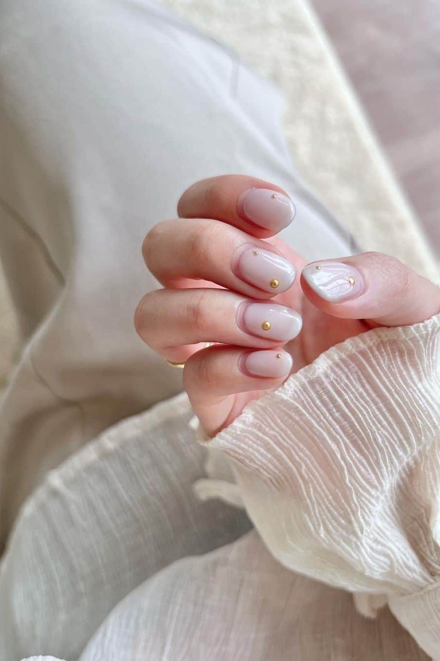 Soft White Pearl French on short oval nails for women over 60