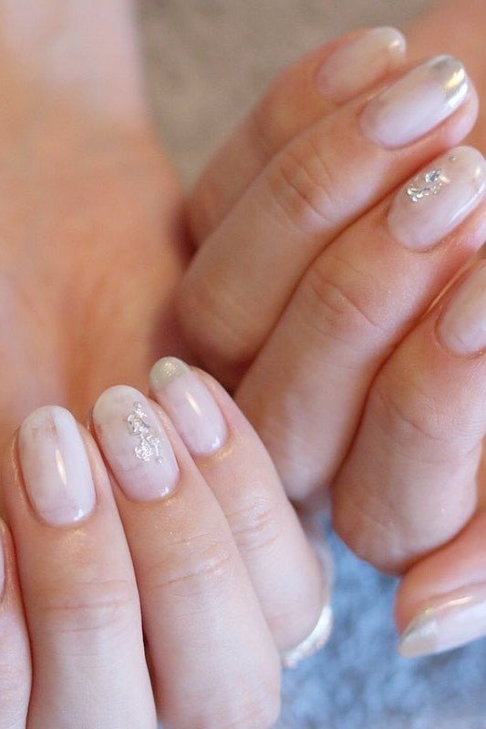 Sheer Pink with Silver Glitter on short oval nails for women over 60
