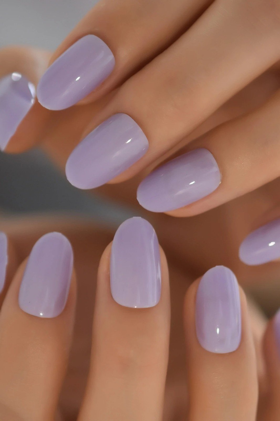 Soft Lilac Solid on short oval nails for women over 60