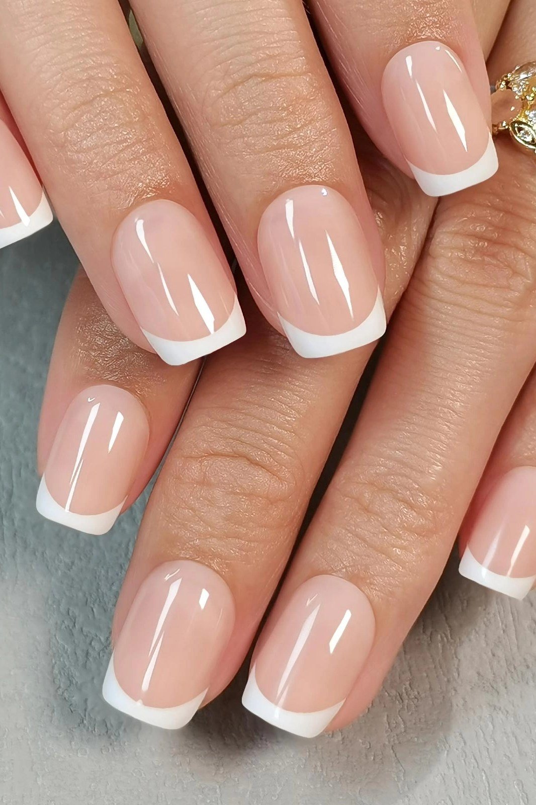 Elegant classic white French tips on glossy nude base, square for women over 40