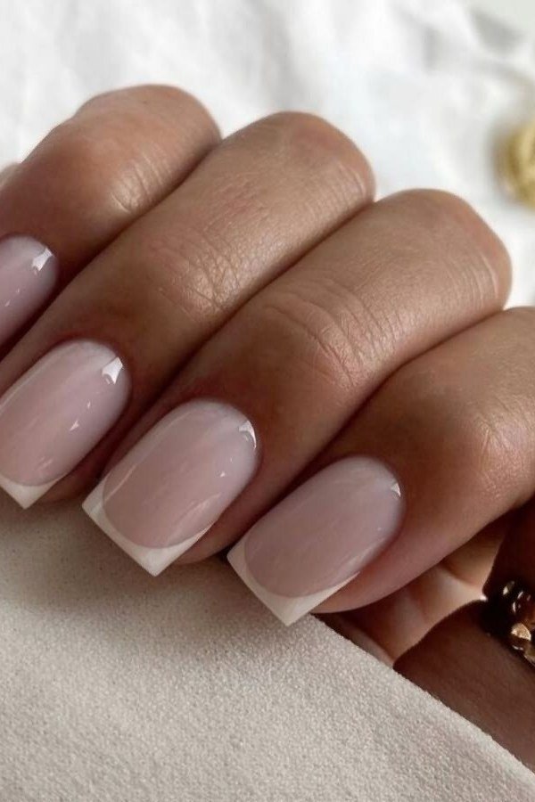 Elegant baby pink French tips on short square nails for women over 40