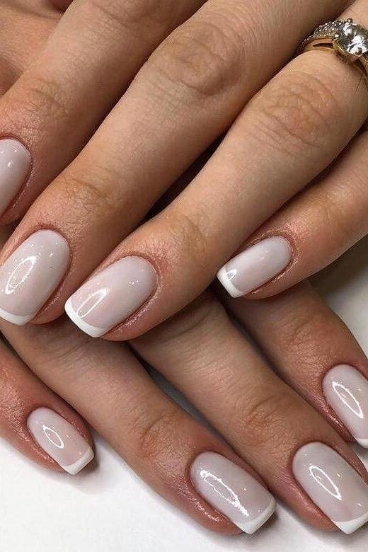 Elegant white almond French tips with a vintage ring for women over 40