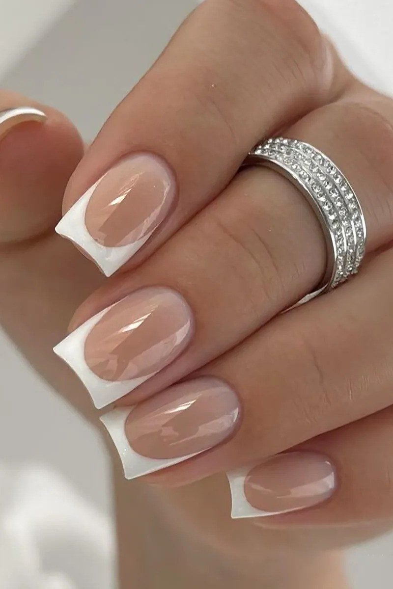 Elegant bold white square French tips with a sparkle ring for women over 40