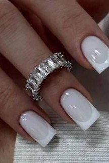 Elegant white square French tips with a statement ring for women over 40
