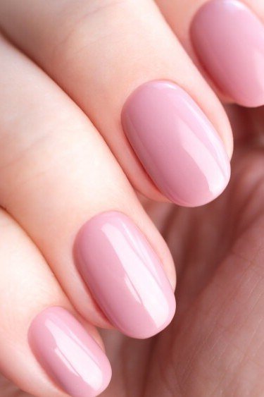 Elegant dusty rose pink squoval nails, side view for women over 40