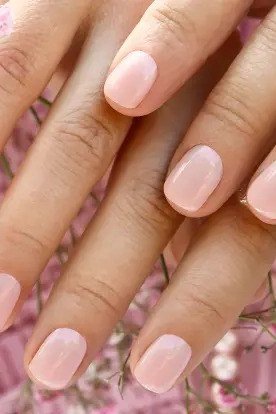Elegant pale pink almond nails with pink flowers for women over 40