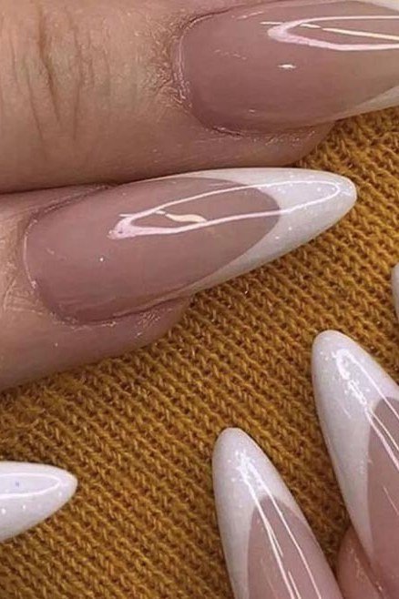 French tip almond nails with white tips, closeup