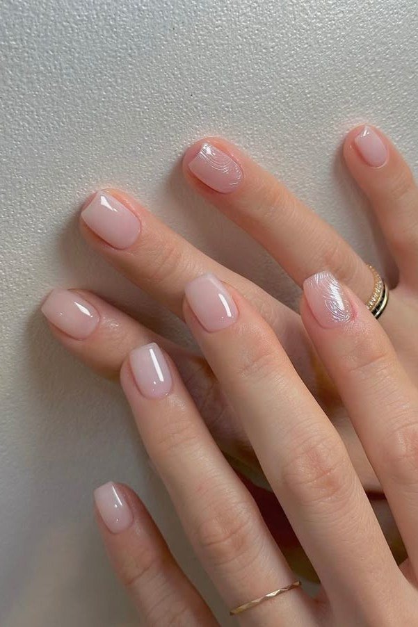 Pale pink almond nails on hands