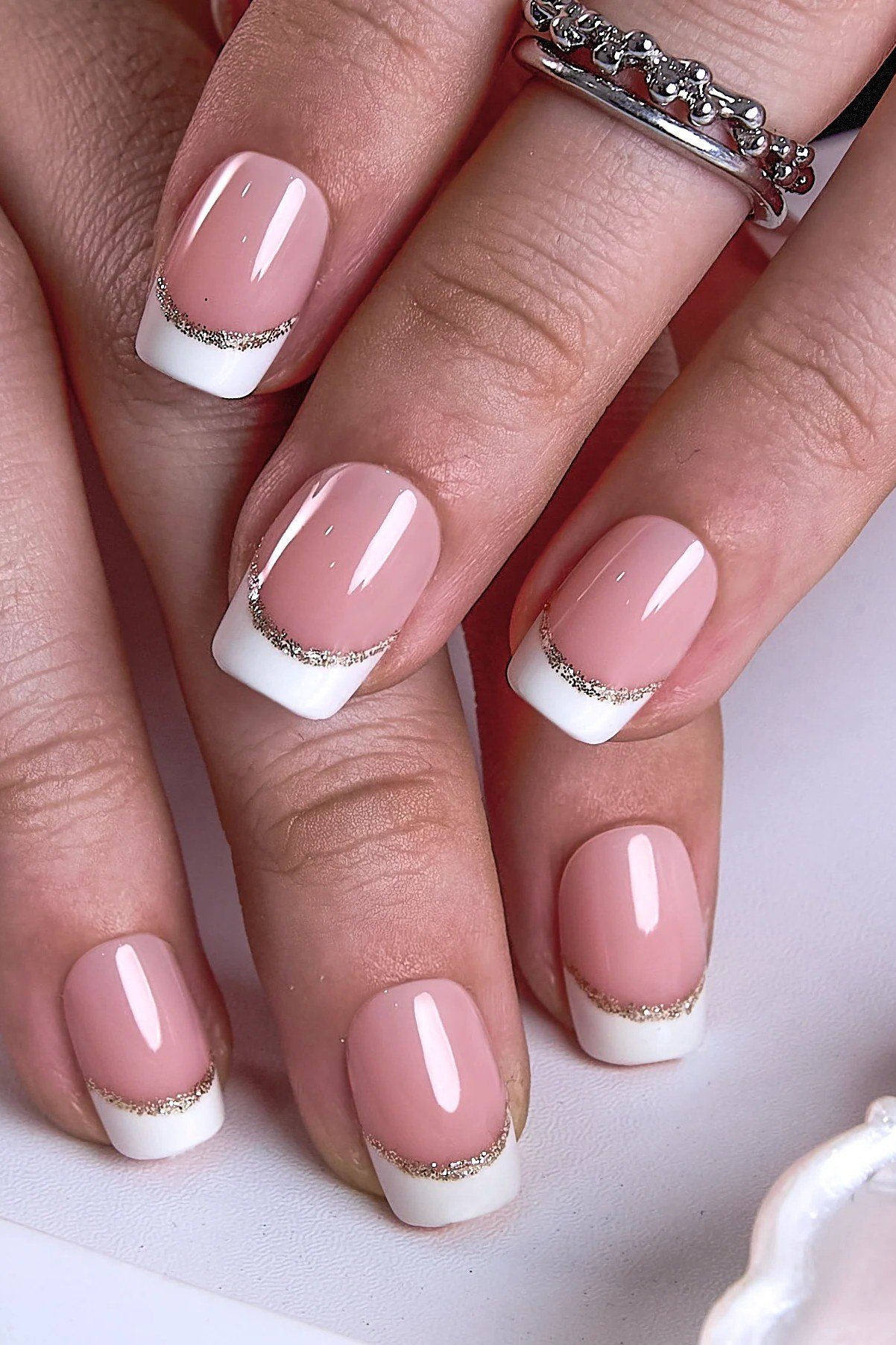 French tip almond nails with silver line detail