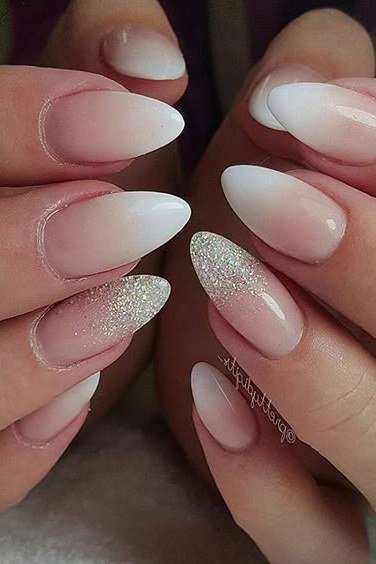 White to silver glitter ombre almond nails, closeup