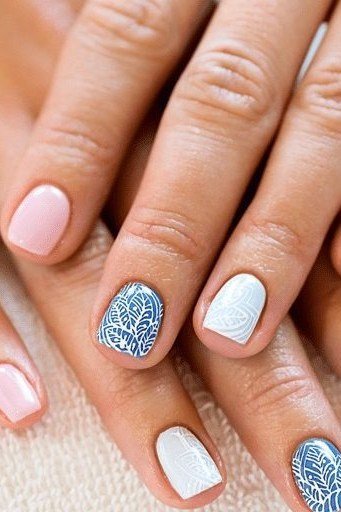 White oval nails with blue glitter accent nail