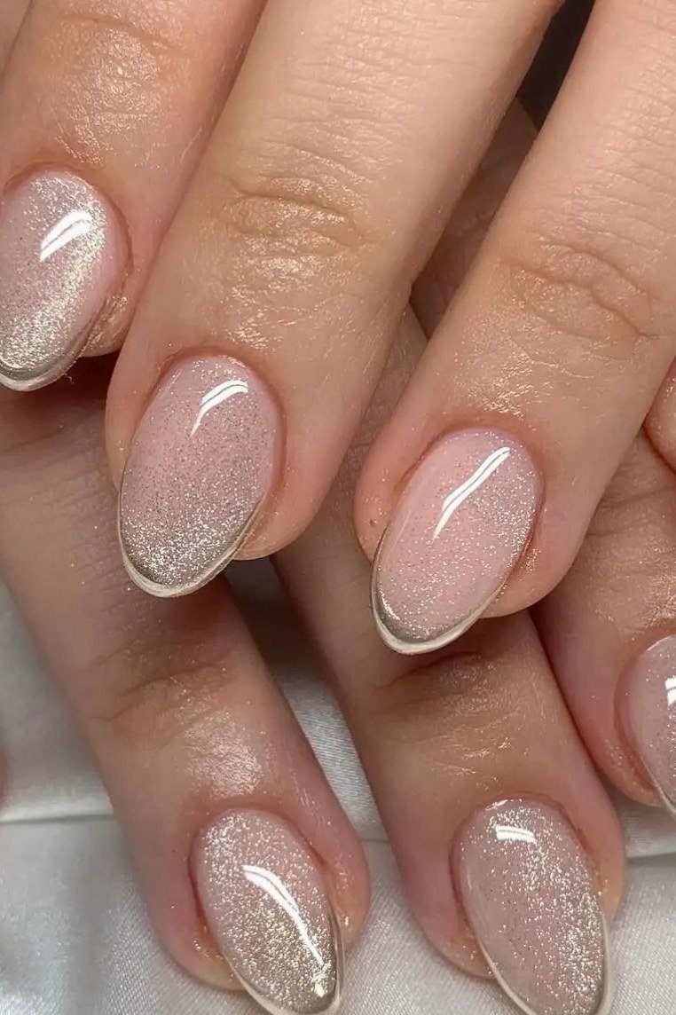 Champagne pearl oval nails, hands with rings