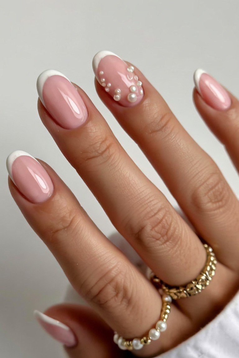 Pink french tip almond nails with pearl details