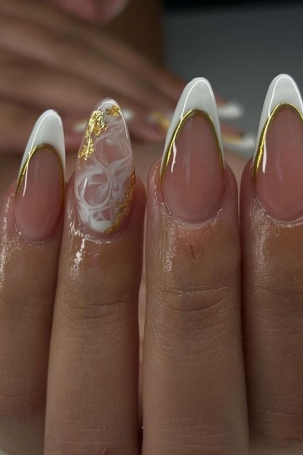 White french tip almond nails with gold detail