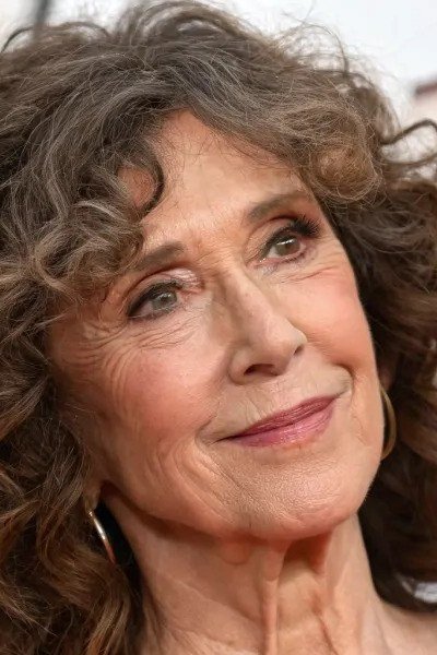 tousled brown curly shag haircut for older women
