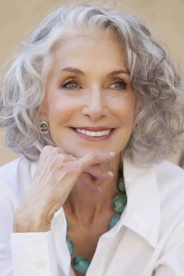 sunlit long grey curls outdoors for women over 60