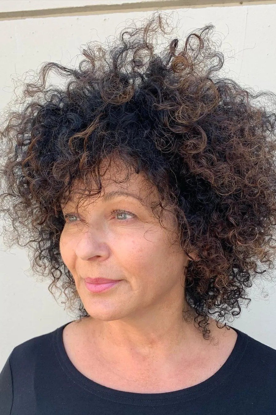 voluminous grey afro halo on dark skin