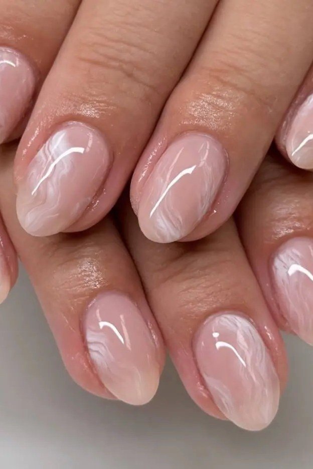 14. Sheer Marble Pink Almond Nails - nail art idea for women over 40