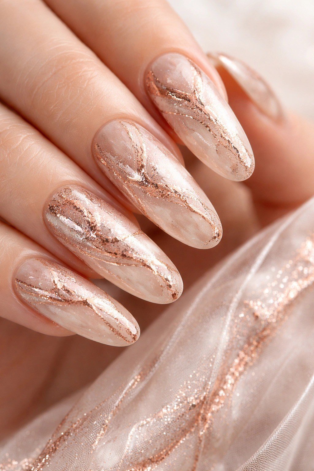 40. Rose Gold Marble Veins on Long Almonds - nail art idea for women over 40