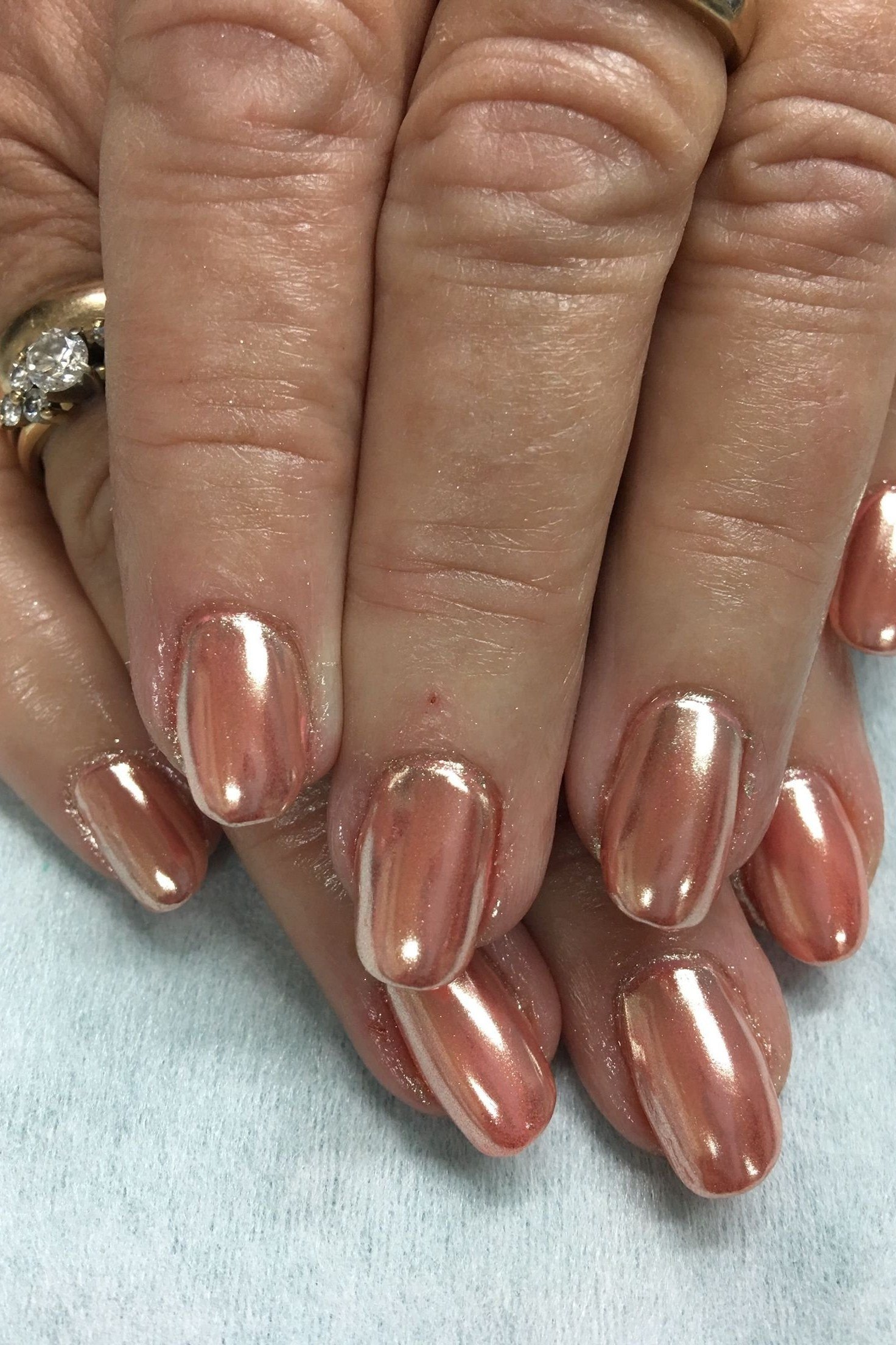 Rose gold chrome nails, close-up