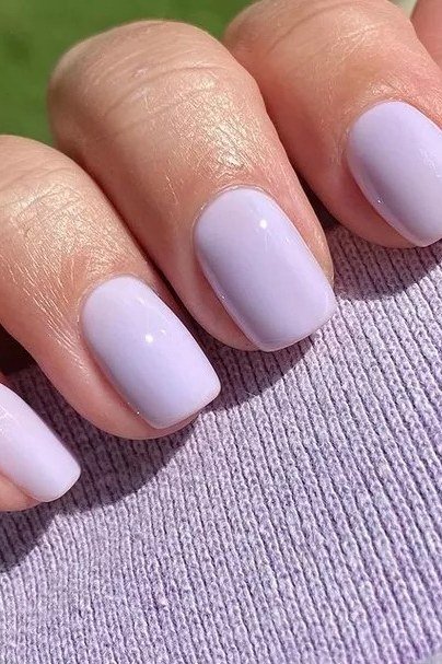 Soft lavender nails, young hands
