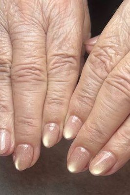 Gold chrome almond nails, older hands