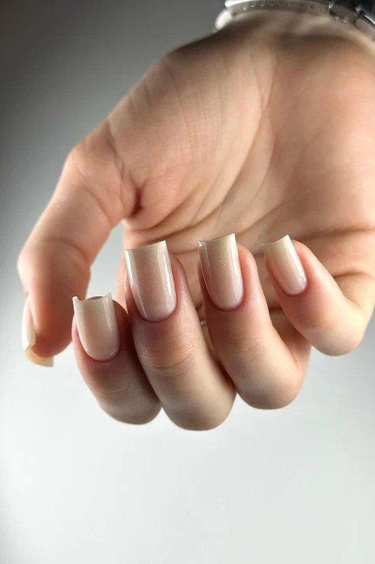 Relaxed Fist Nude Oval Ombre - nude ombre nails for women over 50