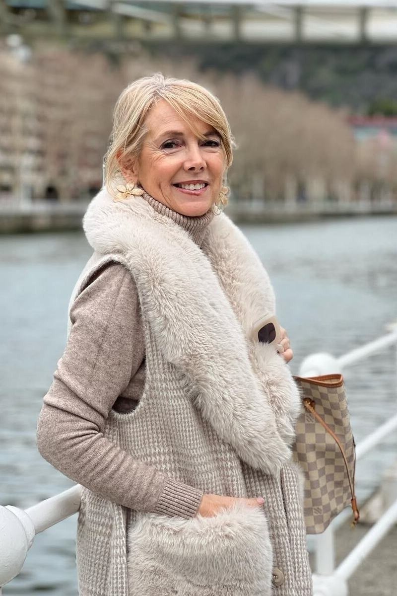 Beige knit vest layered outfit, soft casual look for women over 60