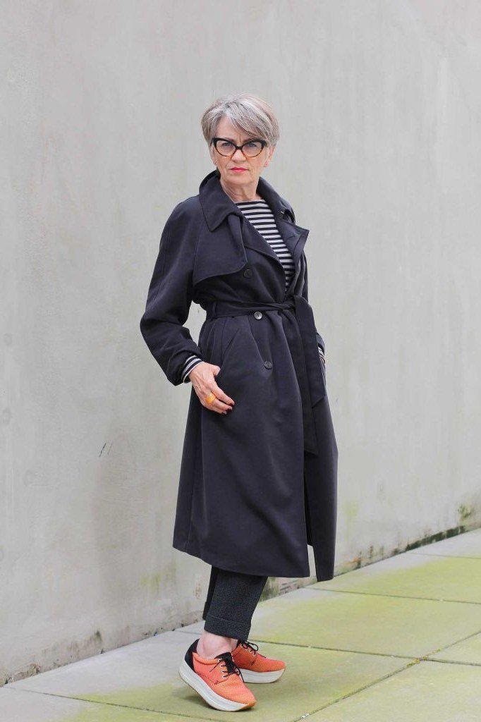 october outfits for women over 60: navy trench striped scarf orange sneakers