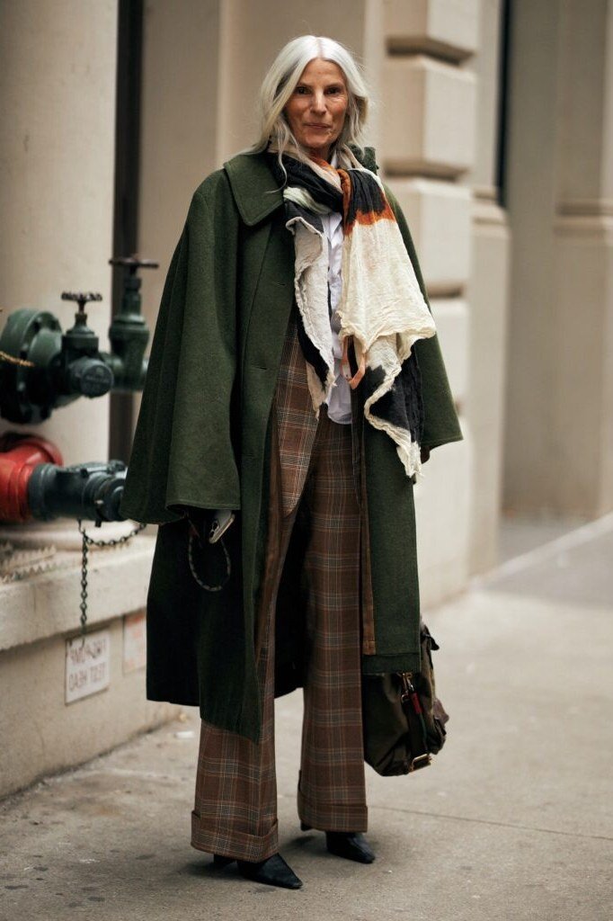 october outfits for women over 60: green coat cream scarf plaid wide trousers