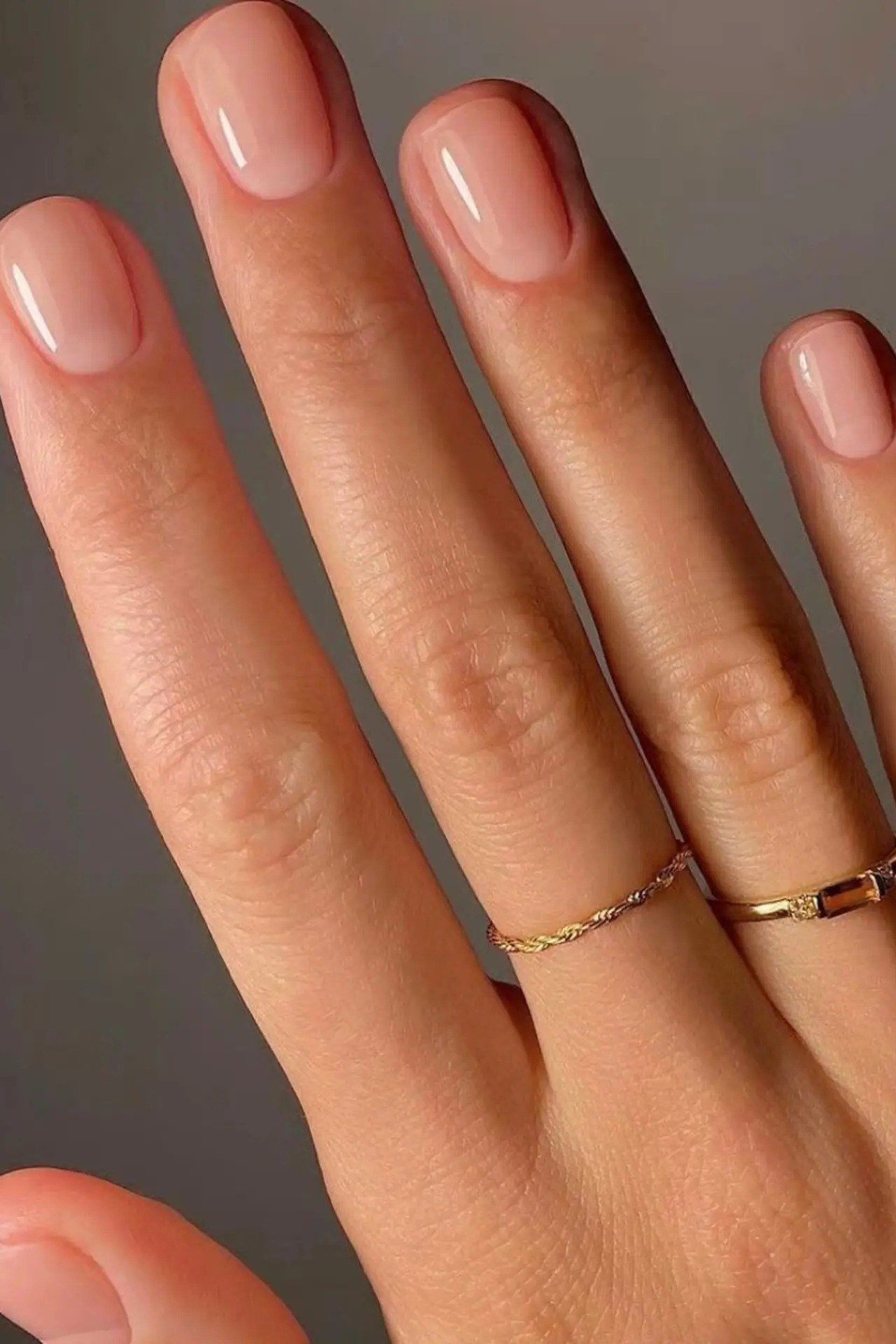 Old money nude nails with gold rings manicure for women over 60
