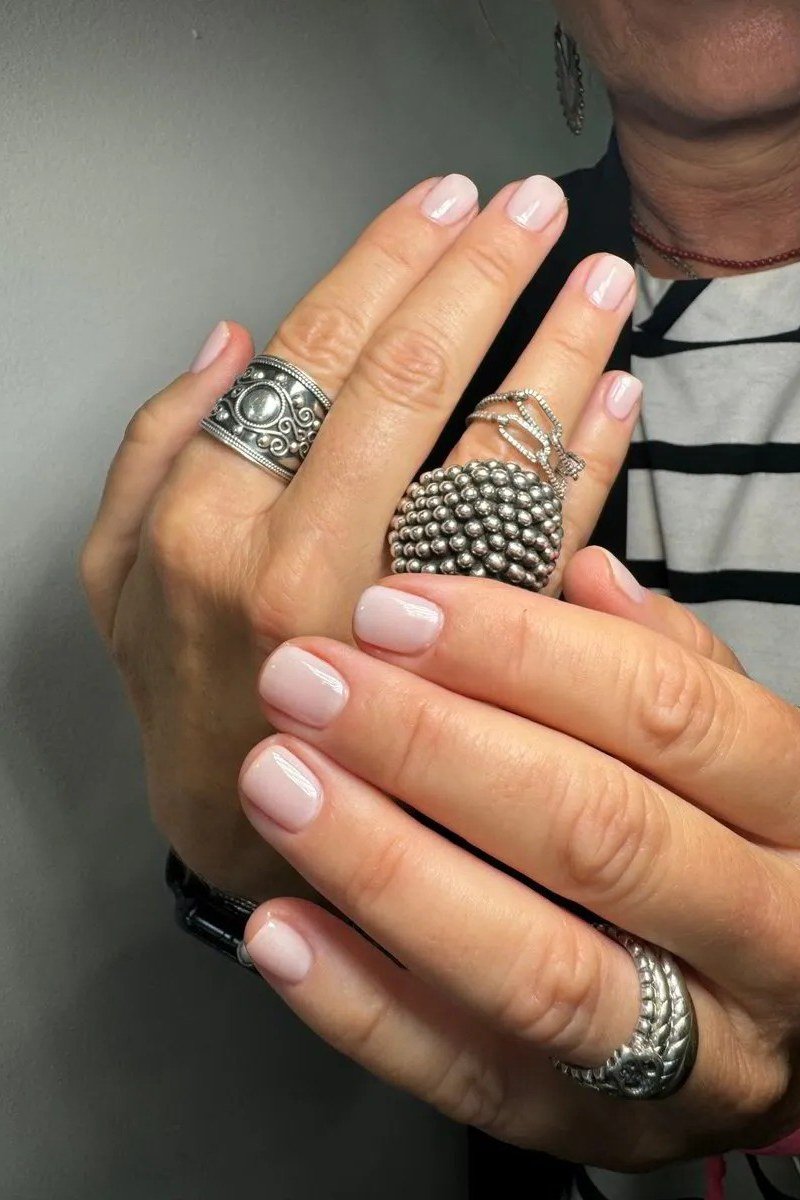 Old money nude almond nails with statement rings manicure for women over 60