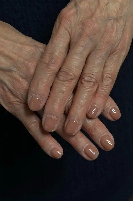 Old money glossy nude almond nails manicure for women over 60