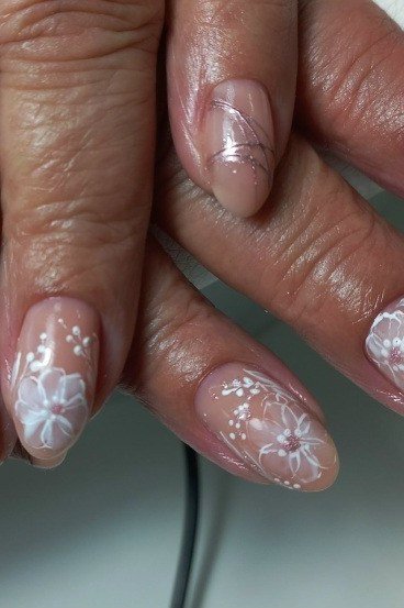 Old money nude nails with white floral lace manicure for women over 60