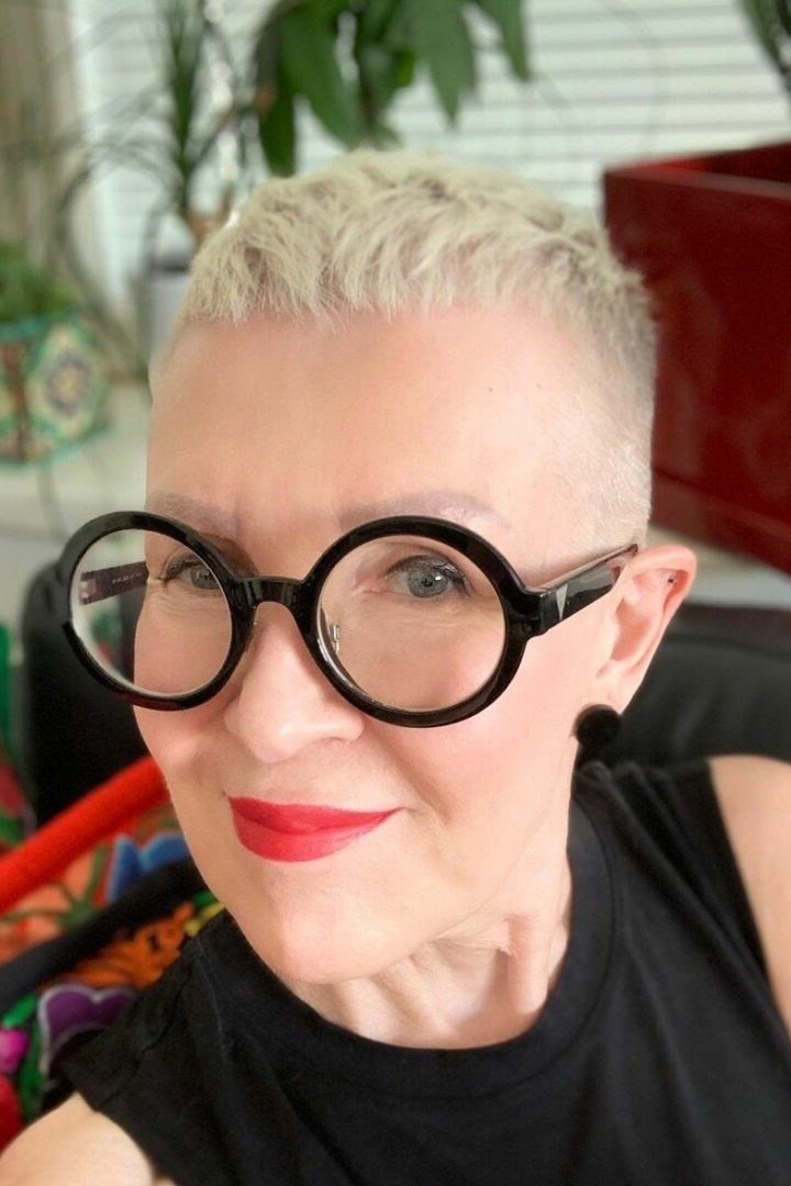 White pixie with big black round glasses, selfie style - pixie haircut for women over 60