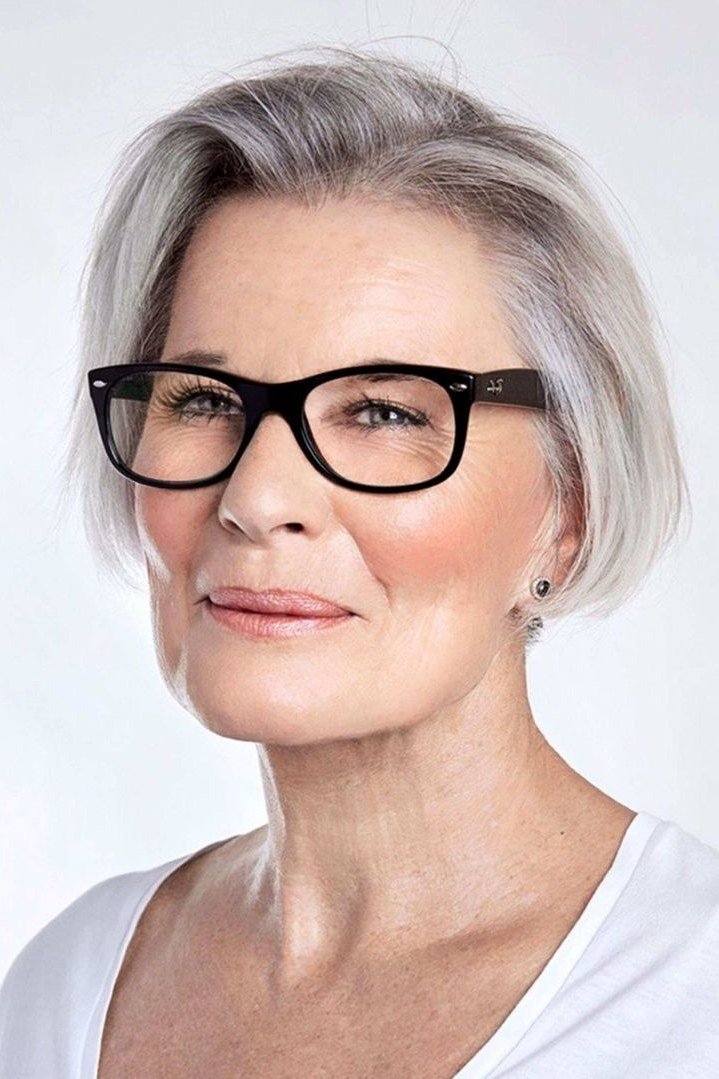 Silver pixie with black glasses, front view - pixie haircut for women over 60