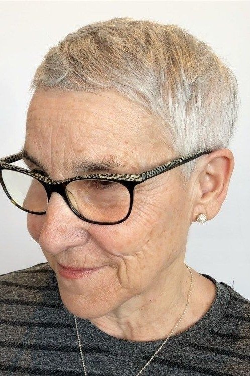 Blonde pixie with black glasses, three-quarter view - pixie haircut for women over 60
