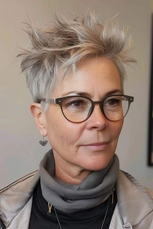 Spiky grey pixie with round glasses - pixie haircut for women over 60
